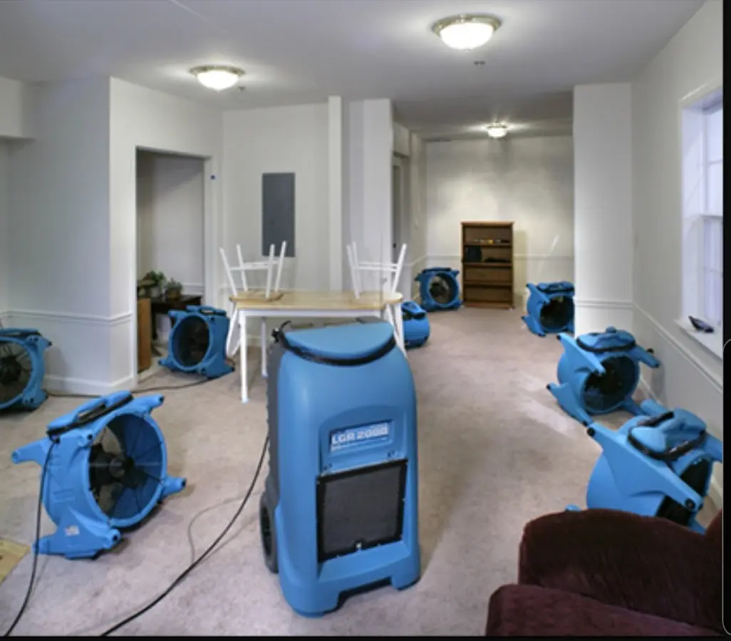 Air movers and dehumidifier setup for Water Damage Restoration in Nibley